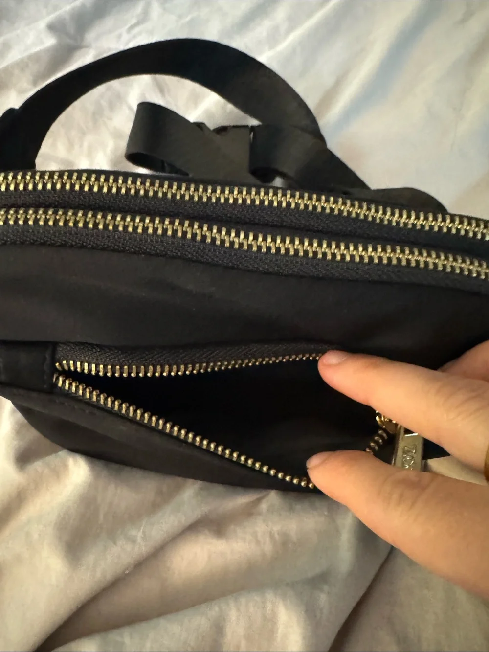 Black Crossbody Bag with Gold Zipper Pull by Zorfin